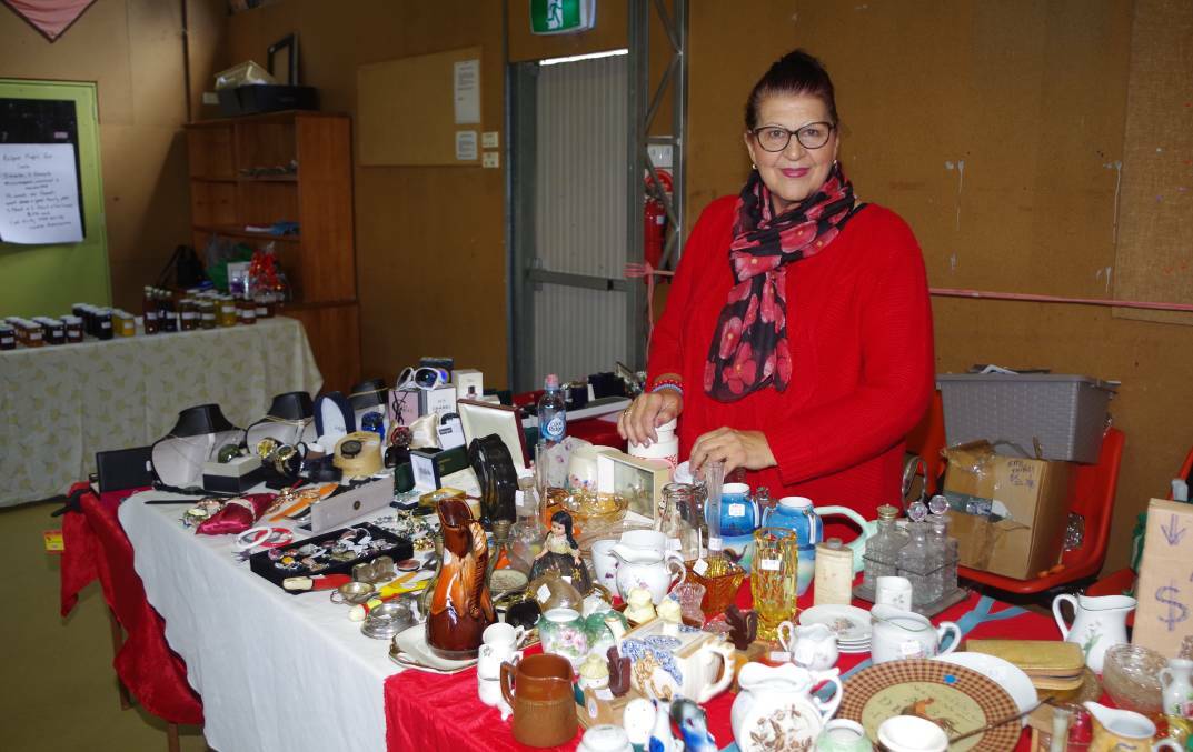 Cynthia Nicholson with some of her trinkets, collectables and old wares at a previous market. Photo: File.