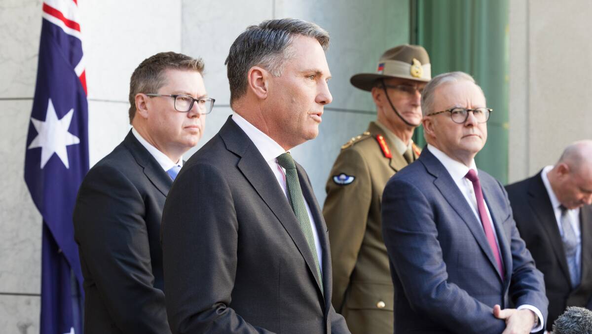 Defence Minister Richard Marles, Prime Minister Anthony Albanese and others announce the Defence Strategic Review. Picture by Sitthixay Ditthavong