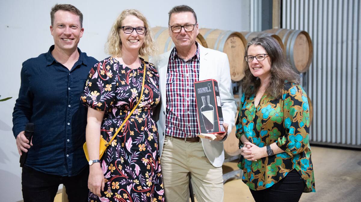 Winners are grinners, Jill and Michael Bynon enjoy the fruits of their labour in the wine industry. Image supplied. 