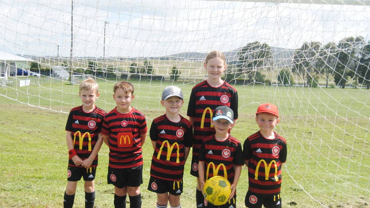 Young soccer enthusiasts Issac Writght, Hunter Whithington, Luca Mills, Koby Tool, Jackson Metal and Alara Ferguson were excited to get given a lesson from the pros. Image by Jacqui Lyons. 