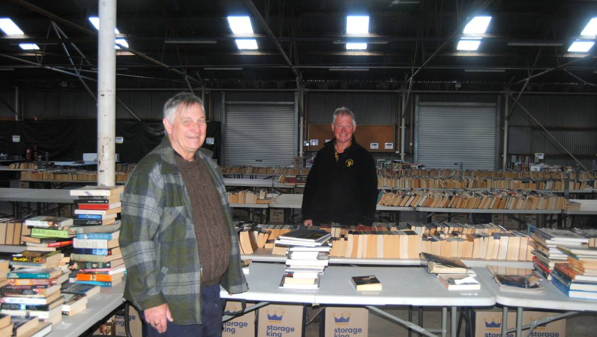 Rotary volunteers Graeme Neil and Doug Boyling have spent days sorting through donations. Image by Jacqui Lyons. 