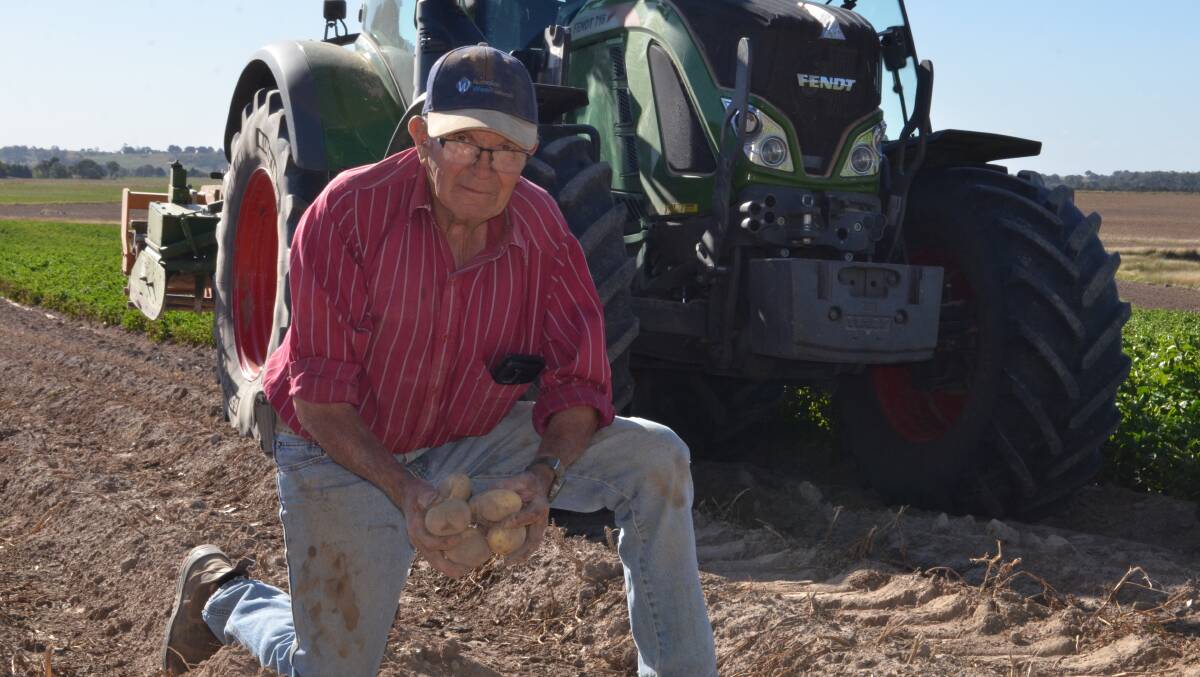 John Bensley, Stillbrook, Crookwell with a handful of Carisma certified seed potatoes on the point of harvest.