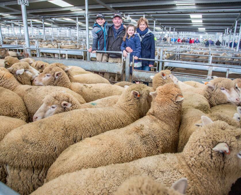 Bernie, Tania. Edward and Emily Cusack, Galong, topped Wednesday's market with Holman Tolmie, selling 43 crossbred lambs for $328 a head.