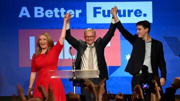 Anthony Albanese, centre, celebrates with his partner Jodie Haydon and son Nathan Albanese after after winning the 2022 federal election. Picture: AAP