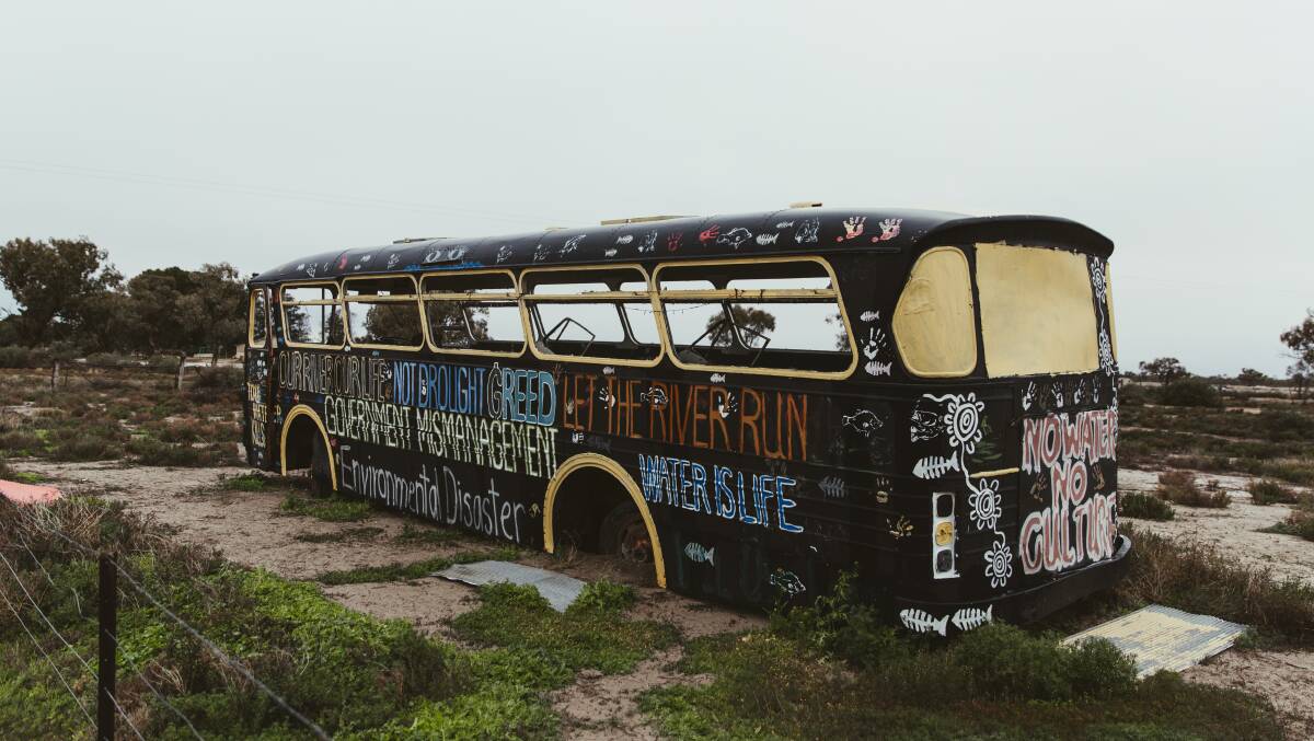 A bus at Menindee wears the anger of the community. Picture: Dion Georgopoulos 