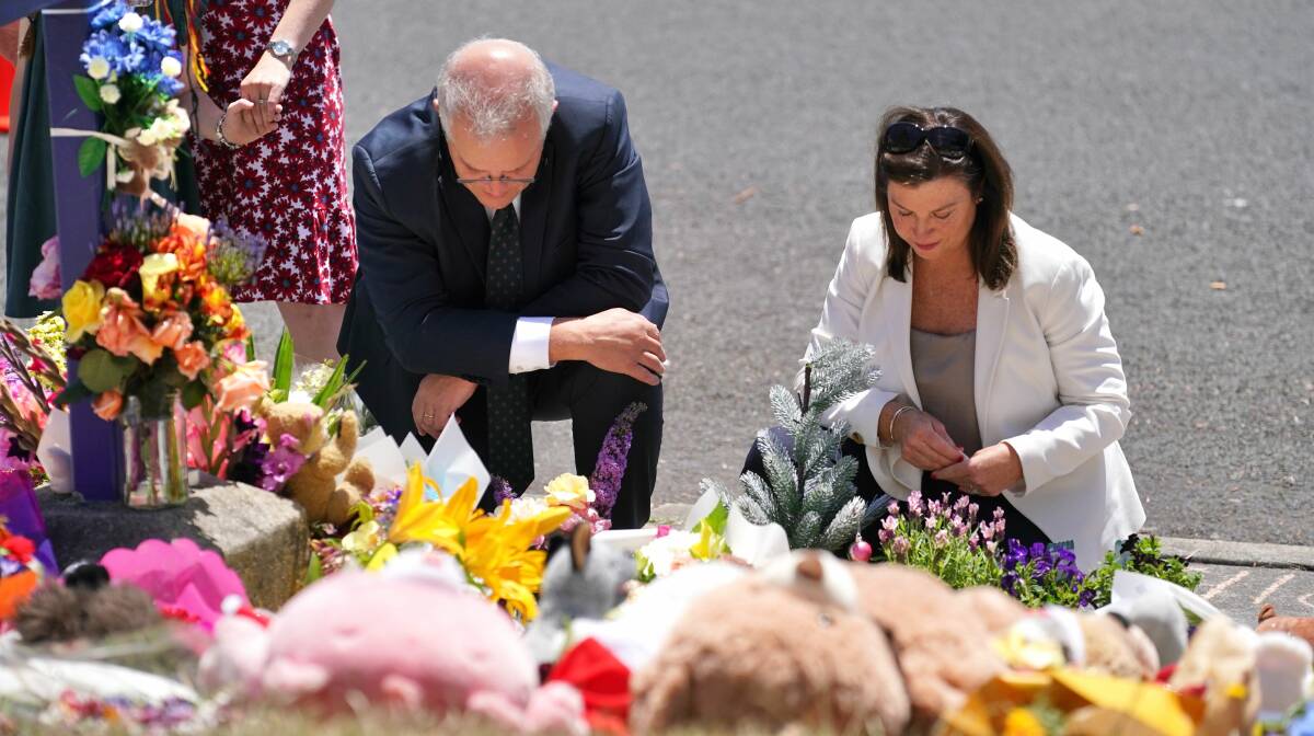 Scott and Jenny Morrison pay their respects at Hillcrest Primary School.