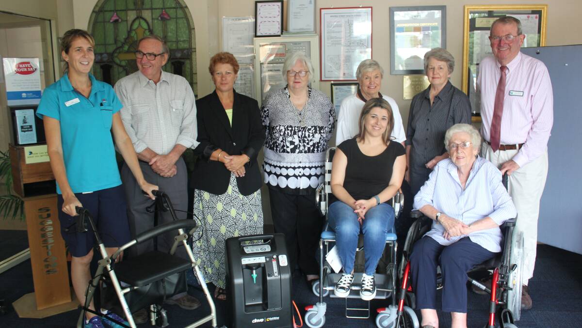 NEW EQUIPMENT: Emily Marchese, Barry Gale, Rosie Doherty, Faye Long, Janelle Humphries,Melissa Burgess, Maxine Elder, Sue Hannan, Danny Kennedy stand with the new equipment to Bourke Street Health Service. Photo: Mariam Koslay. 