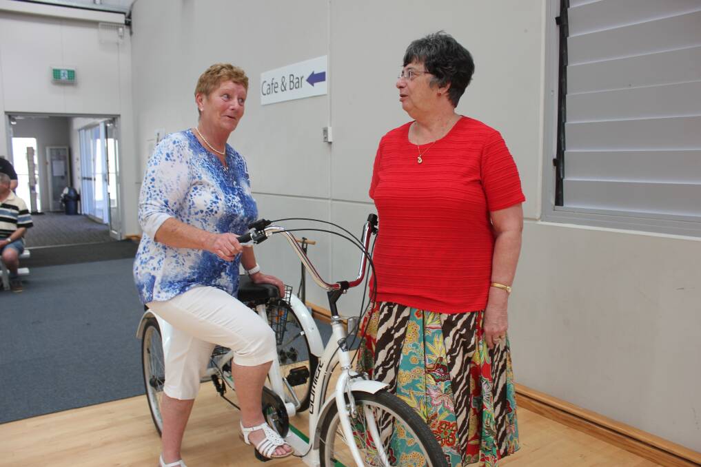 Marlene Skipper and Lyn Stackenburg stare each other down as competitors for the safety bike race at the Grace Millsom Centre for Seniors Week. 