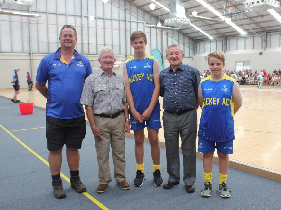 International hockey player Errol Bill with stepson Andrew, grandchildren Dylan and Cameron Brick - and brother Allan at the Festival of Hockey on Friday.