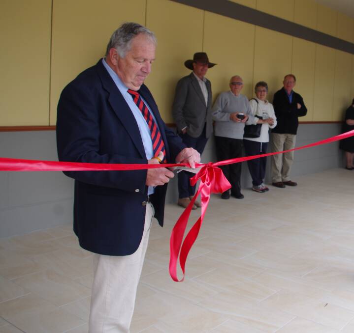 RIBBON CEREMONY: Residents, owners and guests watch as respected Dr Paul Falk cuts the ribbon at the opening ceremony of the Goulburn Health Hub on Saturday morning. Photos: Darryl Fernance. 