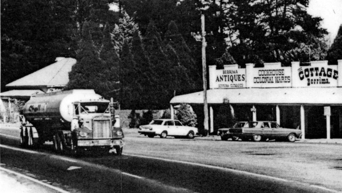 RISKY BUSINESS: A petrol tanker passes through the centre of Berrima on the highway, 1980s. Photos: BDH&FHS