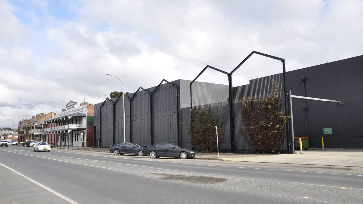 The new Woolworths building hasw been described by a reader as a monstrous, all black mausoleum. He wants soome colour to be added. Photo supplied