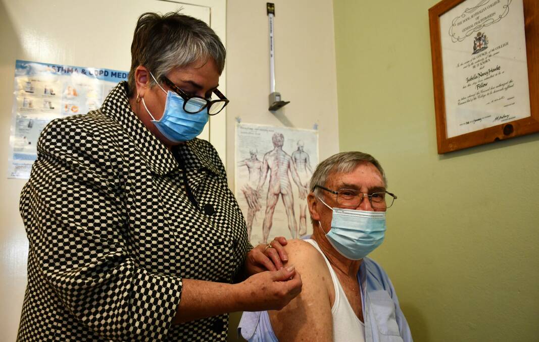 COVID SAFE: Dr Isabella Hawke vaccinates Dr Jack Micklethwaite. Photo: Hannah Neale