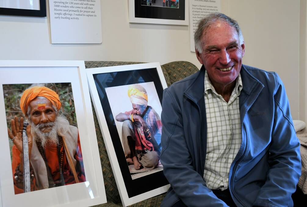 EXHIBITION: Photographer Geoff Henderson with a selection of his portraits. Picture: Hannah Neale