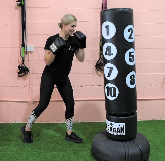 Bonnie Marks boxes at her fitness studio. Photo: Hannah Neale