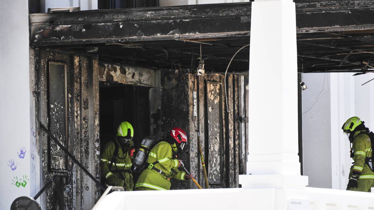 Emergency services extinguish the fire at Old Parliament House in 2021. Picture by Dion Georgopoulos