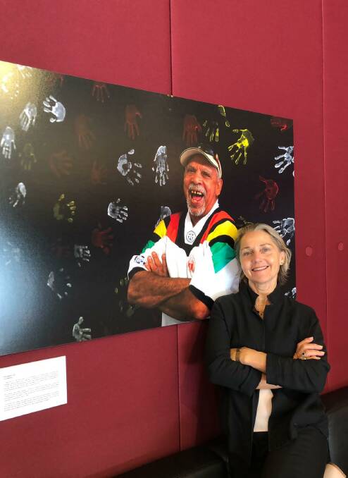 PHOTOGRAPHER: Tina Milson with her portrait of Alfie Walker at the opening of Art of Ageing at Parliament House. The exhibitions Dawn to Dust and Art of Ageing will open at Goulburn Regional Art Gallery, Bourke Street, on Friday March 29. Photo: supplied