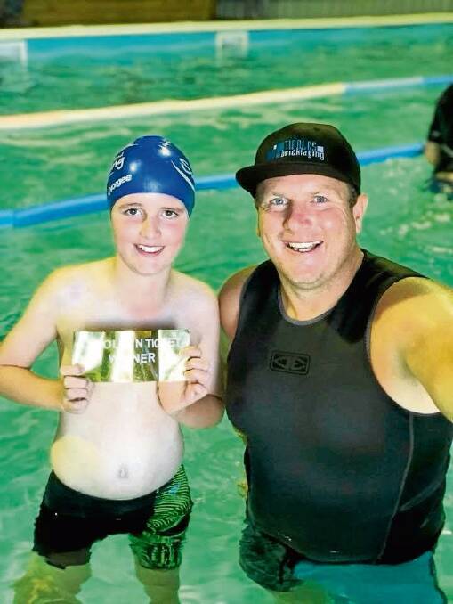 FREESTYLE: Lachlan Rigney enjoys a lesson in the pool with A Stroke Ahead Swimming owner Ricky Edmonds.