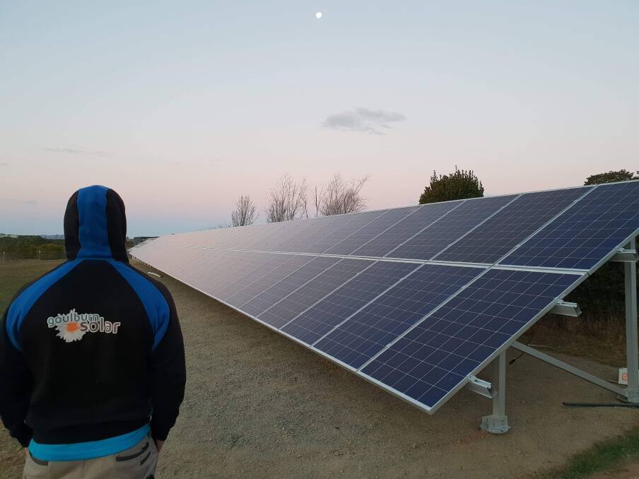 SOLAR: Mitch Daly looks over the Ground Mount system being installed in the Highlands.