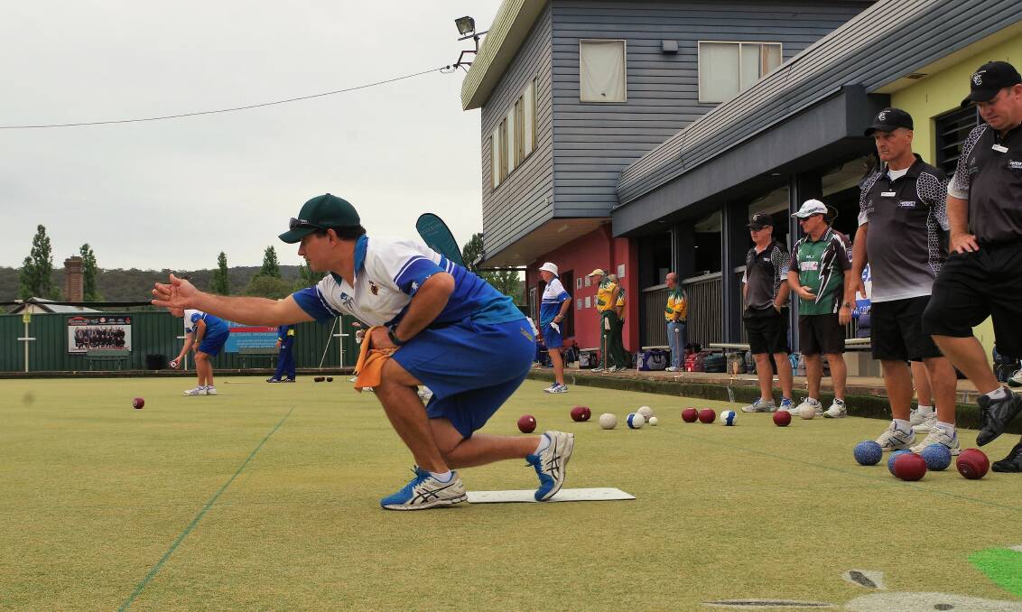 COMPETING: Yass bowler Declan Dunley sends his bowl toward the head in one of the 26 first round Rose Bowl games on Thursday morning. Photo: Darryl Fernance