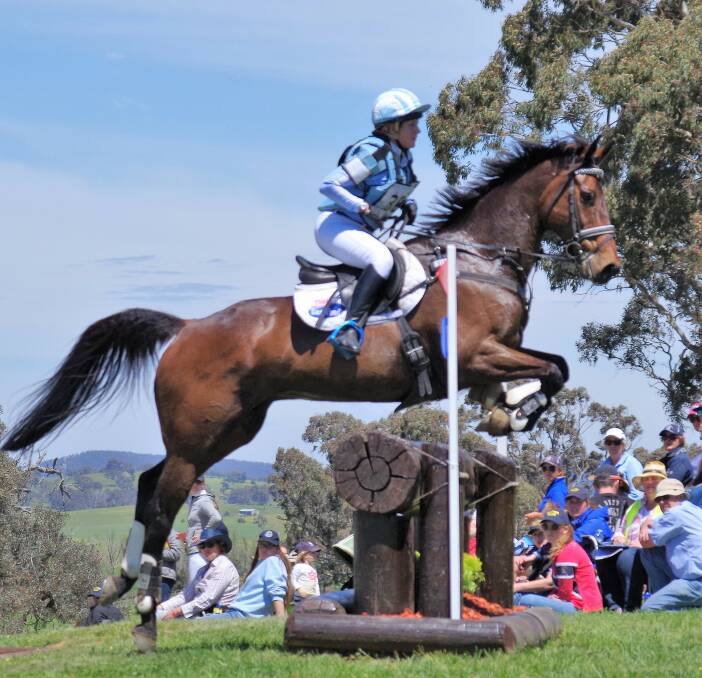 GLIDING OVER: Emily Anker riding Glenwood Park Cooper Street in the CIC three star cross country makes the three element Lynton road crossing  homeward bound jump look easy. Photo: Darryl Fernance