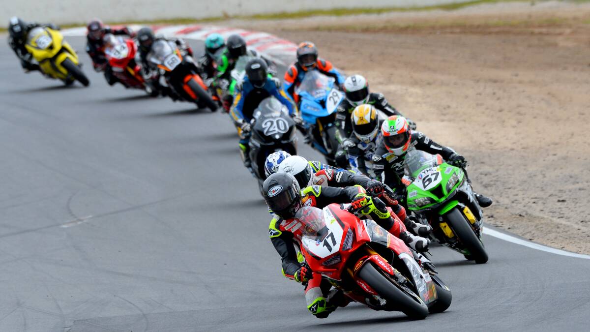 LEADING: Troy Herfoss leads the fight for third place in the second Superbike race at Winton Raceway. Photo: Russell Colvin