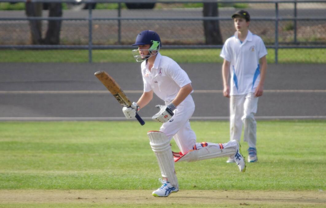 SINGLE: Macleay Robinson looking for a quick single against Crookwell in the under-16s final on Seiffert Oval on Saturday. Photo: Darryl Fernance
