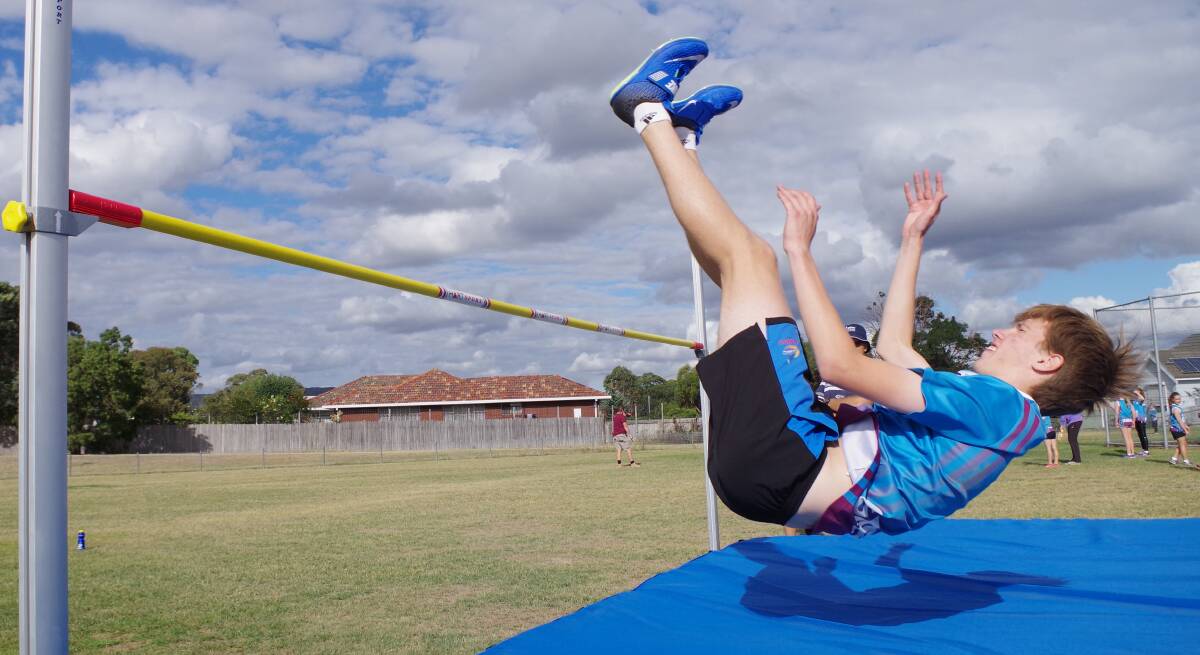 LANDING SAFELY: Ryan Goad clears the high jump bar and is about to land on the new mats at the Goulburn Mulwaree Athletics Club. Photo: Darryl Fernance