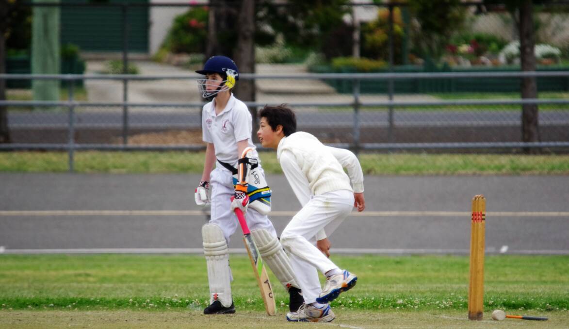 DELIVERING: Wollondilly Green's Pat Craig delivers a bowl to Gold's batsman Abdul Raheem as Alex Mackay waits to run. Photo: Darryl Fernance