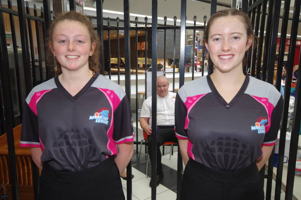 NATIONAL SCHOOLS REFEREES: Rylee Bowles and Kaitlyn Neate  acting as guards for the Lock Up Your Boss fundraiser that will help with their expenses at the National Schools Basketball Championships from November 2-7. Photo: Darryl Fernance