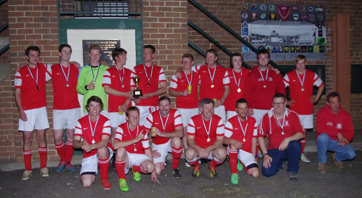 CHAMPIONS: Crookwell Red all age men who defeated Workers FC in the grand final at the Workers Arena on Saturday night. Photo: Darryl Ferenance