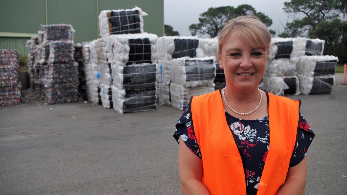 FINDING A MARKET: One of the challenges facing Endeavour Industries manager Sonya Devlin is finding a market for the recycled material. Behind her are bales of good quality, clean, LDPE clear plastic waiting to be picked up for a buyer. Photo: Darryl Fernance