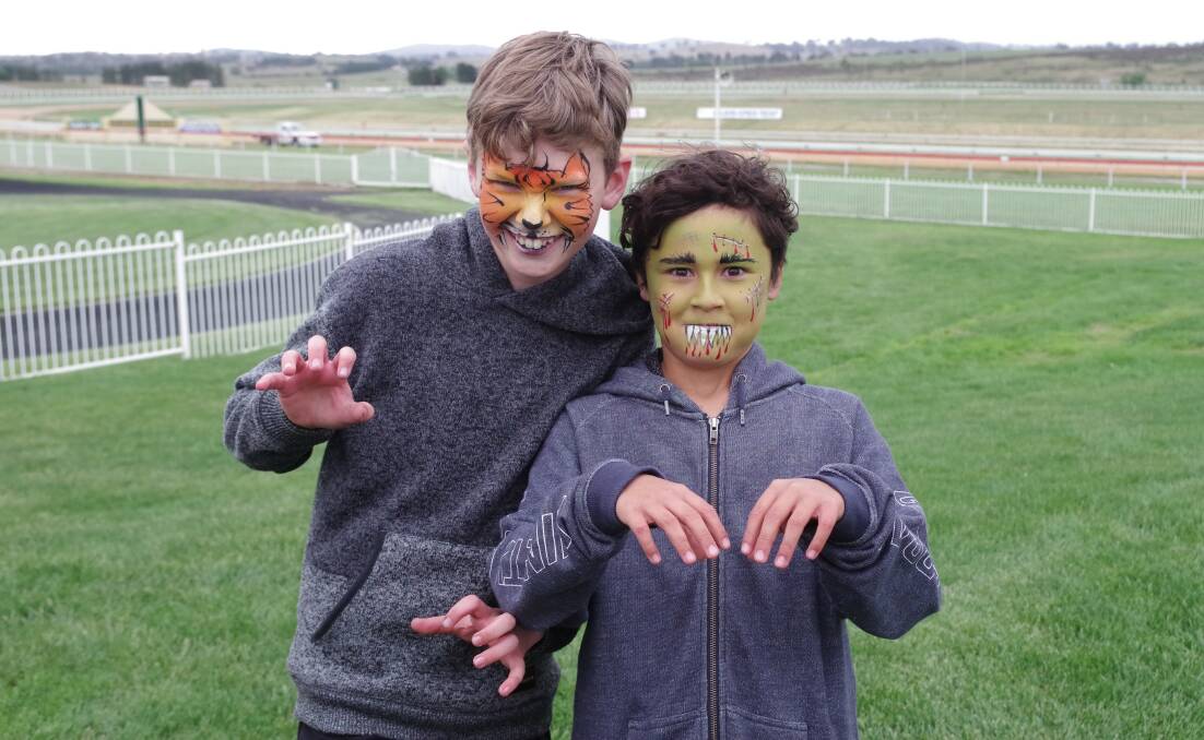 Two young characters at the Goulburn and District Racing Club on Kids Day 2017.