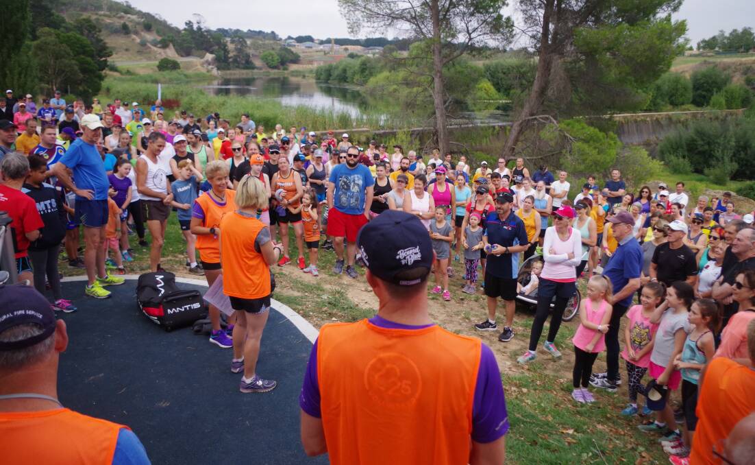 MULTITUDE: Some of the nearly 400 registered participants in Goulburn's first parkrun listening to Angela Hookham explain the safety directives.