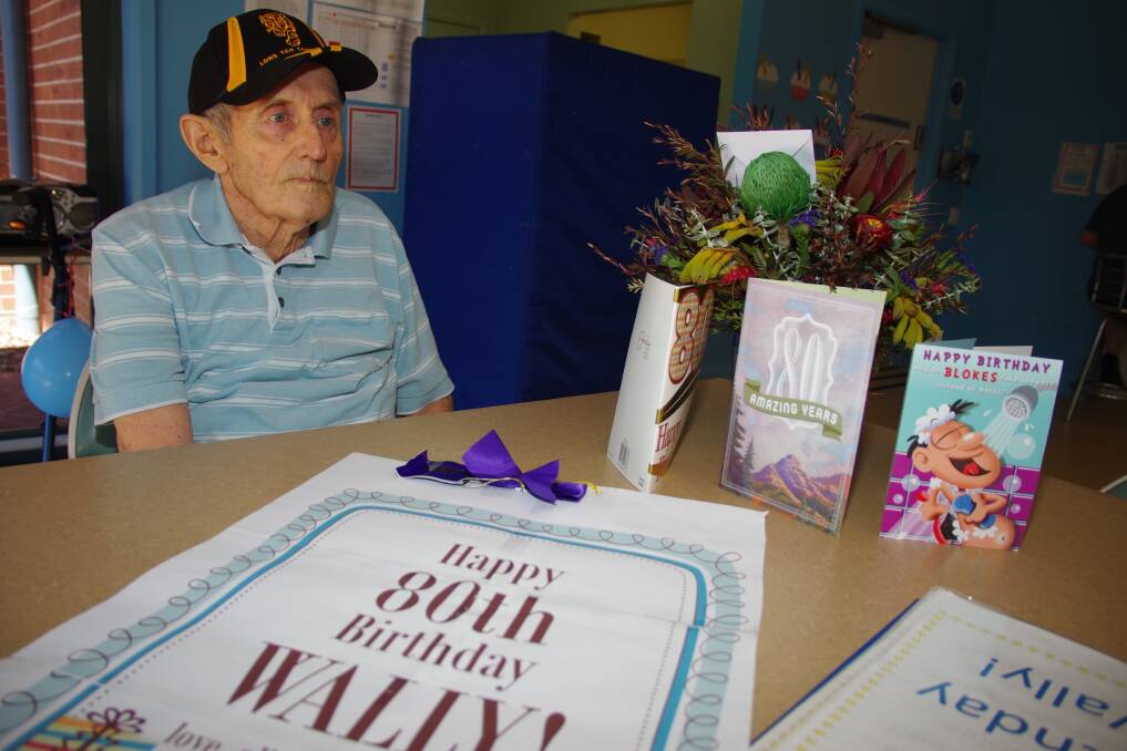 Walter "Wally" Buckland with some of his cards and more well wishes in a folder prepared by the Waminda staff. Photo: Darryl Fernance