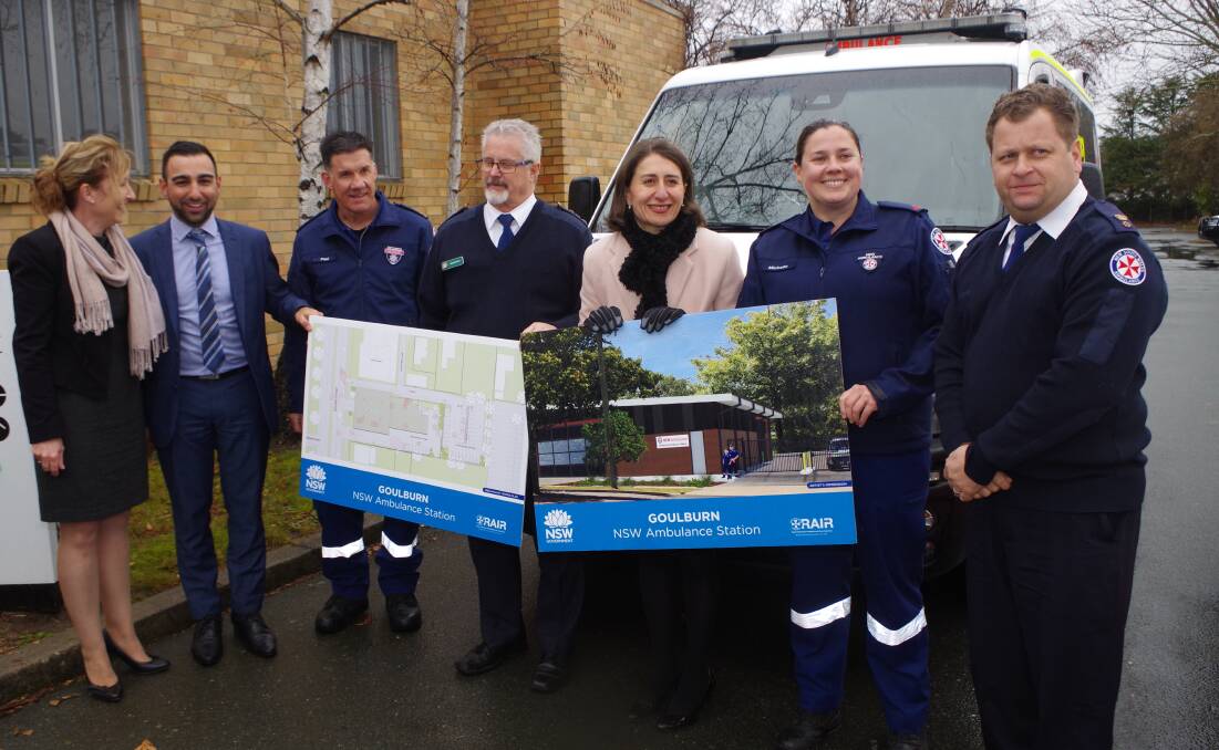 STEP CLOSER: Health infrastructure representatives, NSW Ambulance staff and Premier Gladys Berejiklian with the site plan and concept picture of the planned new Goulburn ambulance station on site on Friday. Photo: Darryl Fernance