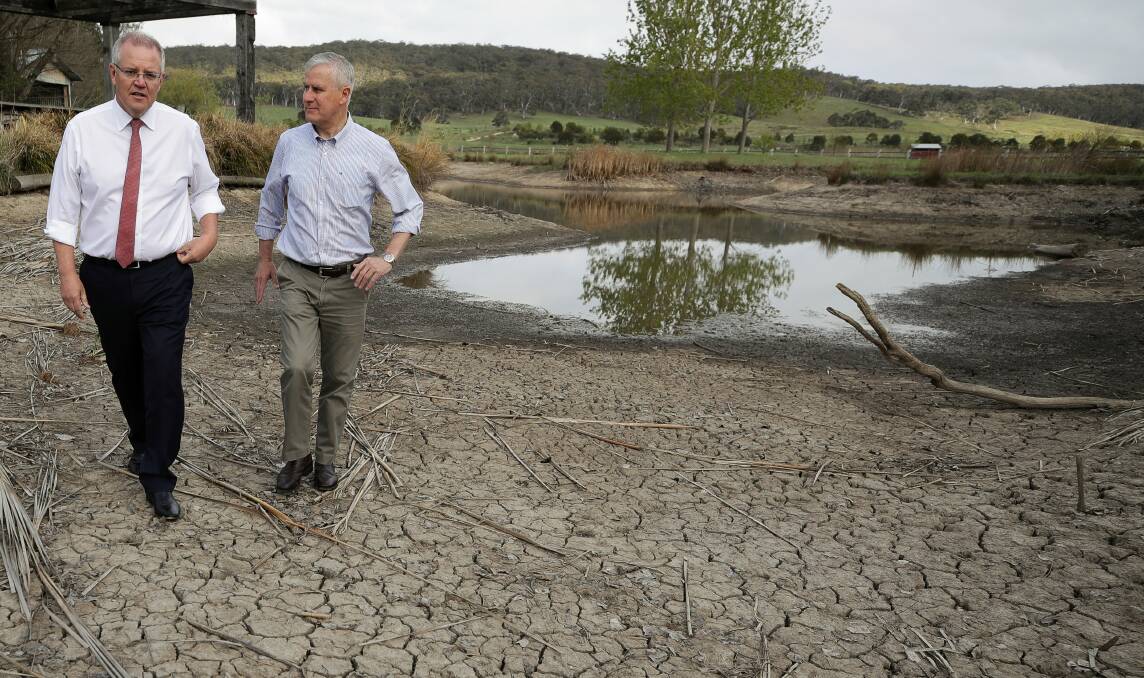 CONCERN: Prime Minister Scott Morrison and Deputy Prime Minister Michael McCormack view a partially dried out dam during their visit to Mulloon Creek Natural Farms to discuss the drought, in Mulloon, NSW, on Thursday 25 October 2018. Photo: Alex Ellinghausen
