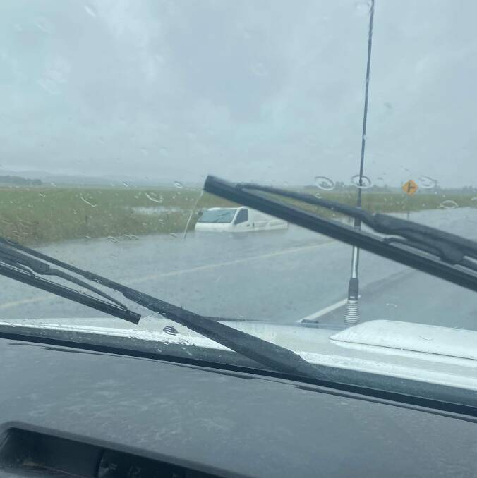 A vehicle was stranded on the Federal Highway, south of Goulburn at Wollogorang Flats, after the driver drove into a flooded area. Photo supplied.