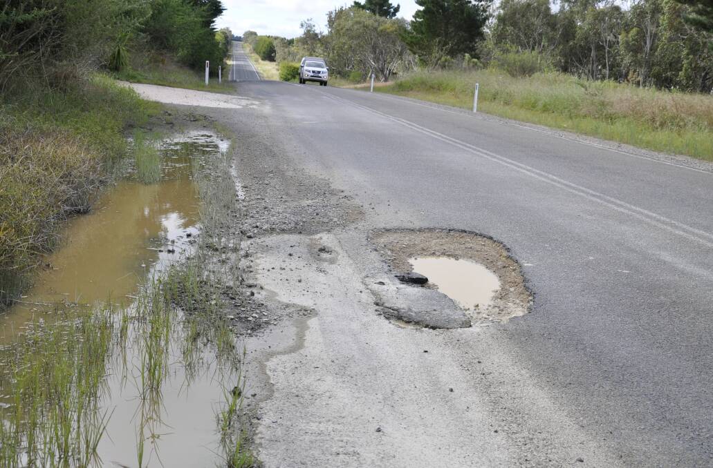 DANGER: A large pothole has developed on Taralga Road, some 25km from Goulburn as a result of heavy rain. Photo: Louise Thrower. 