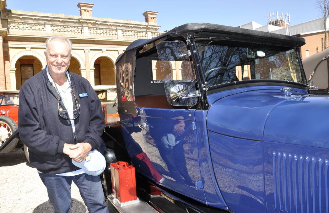 Paul Woodman of Melbourne, who visited Goulburn last week with the Model A Ford group, checked out a 1928/29 utility. Picture by Louise Thrower. 