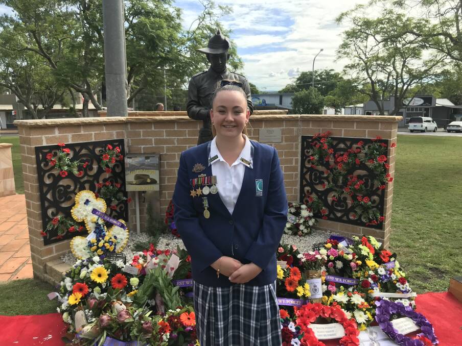 NEVER FORGOTTEN: Lily Marmont, pictured at the Warragamba cenotaph, honoured her grandfather Jim Marmont on Anzac Day. Photos supplied.