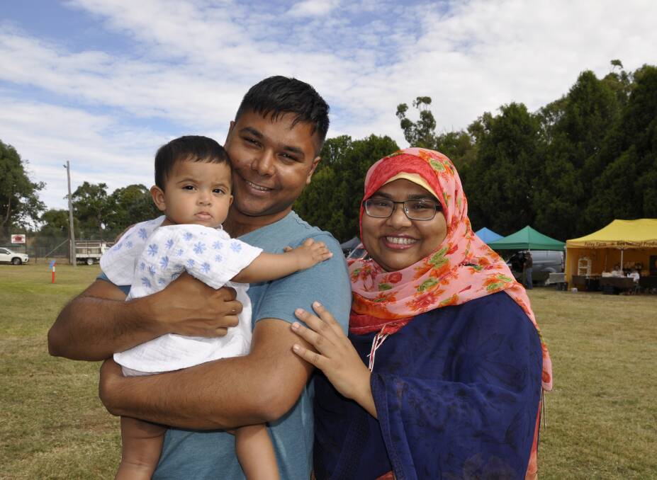 CHUFFED: Zenat Ahsan (right) became an Australian citizen at Tuesday's celebrations at Seiffert Oval. She was accompanied by husband Reza Galib and their child, Liyana Reza. Photo: Louise Thrower. 