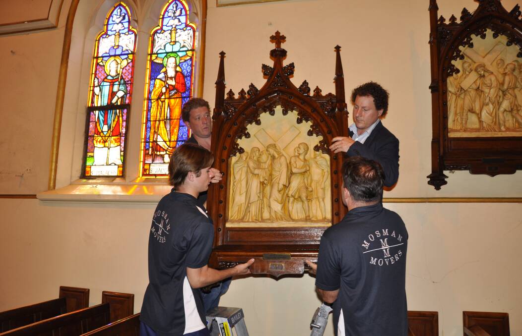 Adam Godijn (right) and Oliver Hull of International Conservation Services removed the Stations of the Cross to start the restoration process in November, 2021. Picture by Louise Thrower.