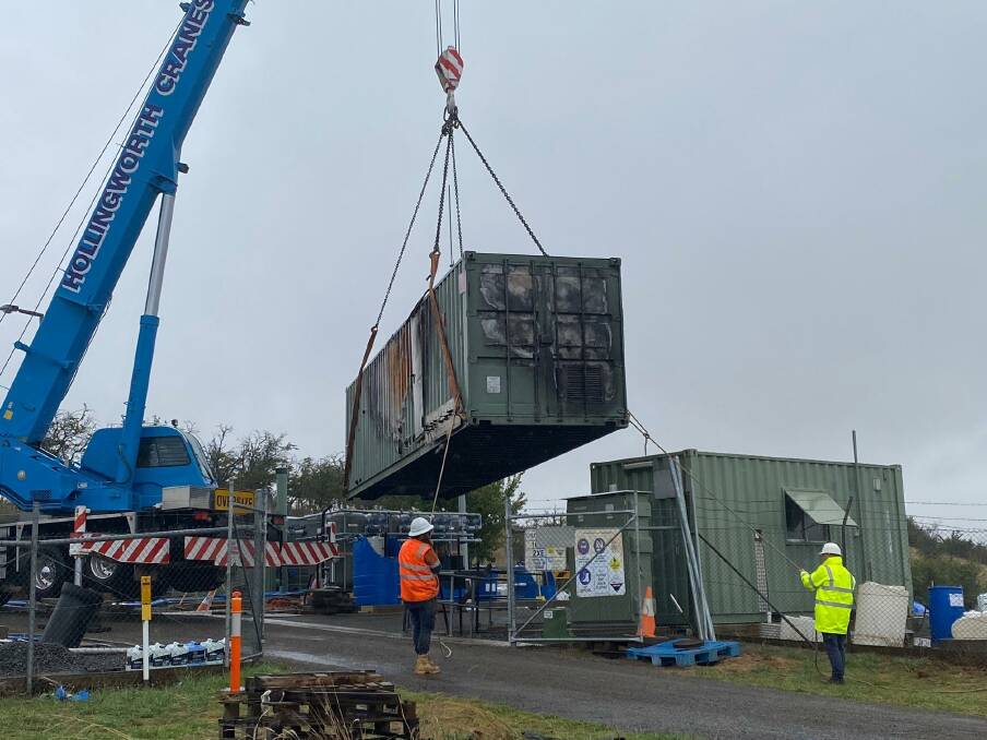 READY: The fire damaged water treatment plant at Taralga was lifted out of the Martyn Street facility last week in preparation for its replacement. The new plant is expected to arrive this week. Photo supplied.
