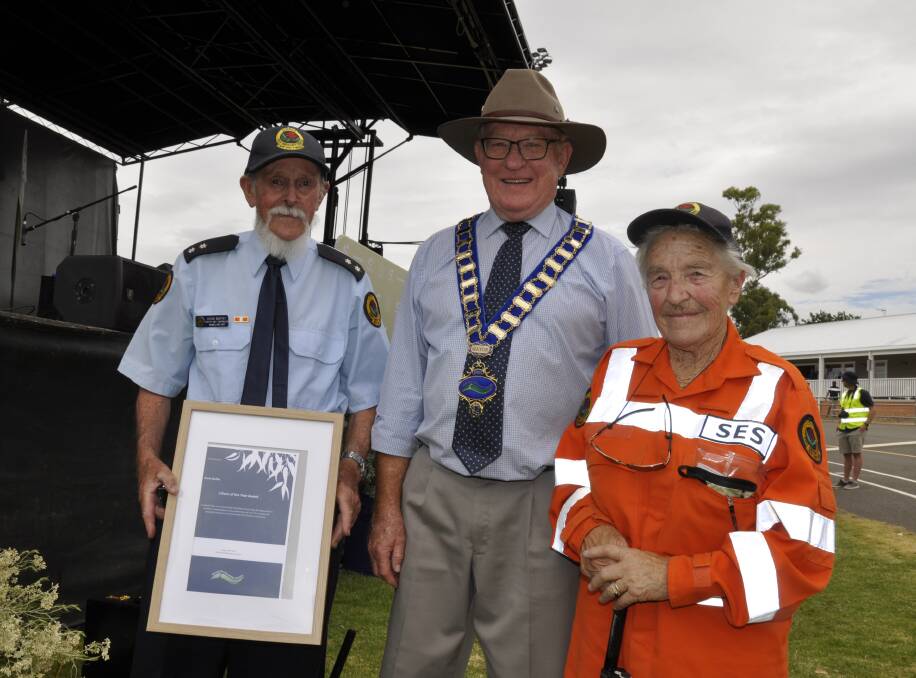 Windellama SES deputy unit controller Kevin Muffet was named as Goulburn's Australia Day citizen of the year in 2021. He is with partner Margaret Burgoine and Mayor Bob Kirk. Photo: Louise Thrower.