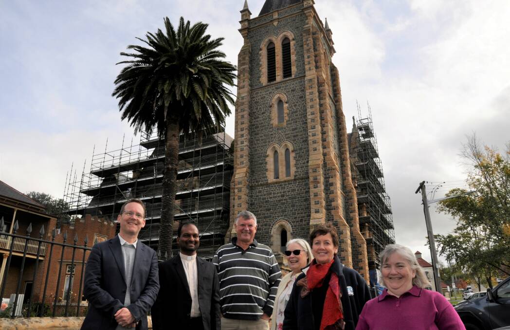 BIG PROJECT: Hume Labor candidate Greg Baines with Mary Queen of Apostles parish priest Joshy Kurien and restoration committee members Matt Casey, Di Green, Dr Ursula Stephens and Penny Gordon. Photo: Louise Thrower