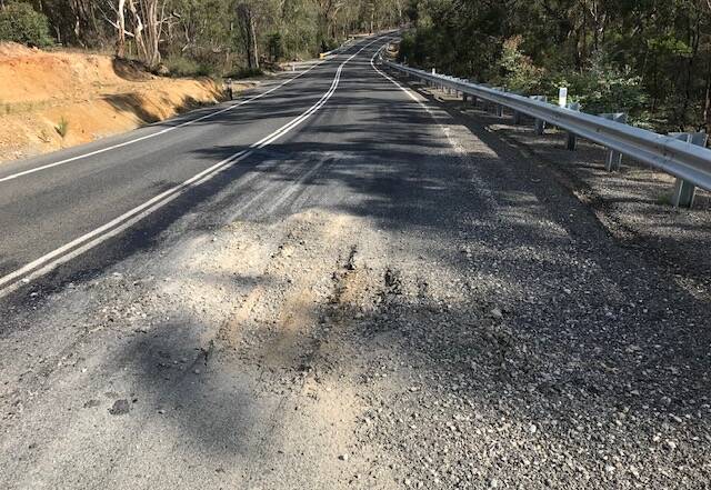 HAZARD: The pavement along Jerrara Road has broken up, despite Multiquip Quarries' work along its haul route. Photo supplied.