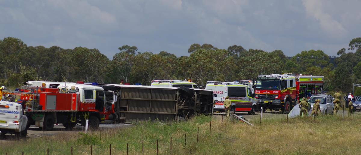 An ADFA bus rolled on Sandy Point Road in November, 2015, injuring 12 people. Photo: Darryl Fernance.