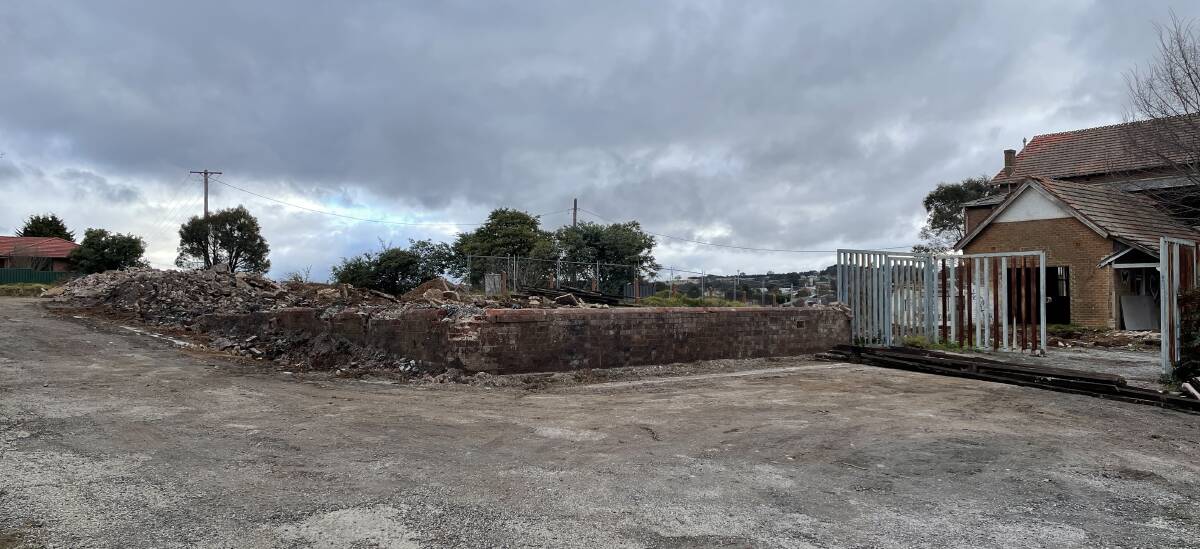 Rubble remained from demolished buildings at the rear of the old orphanage in mid June. The council says this must also be cleared. Photo: Louise Thrower.