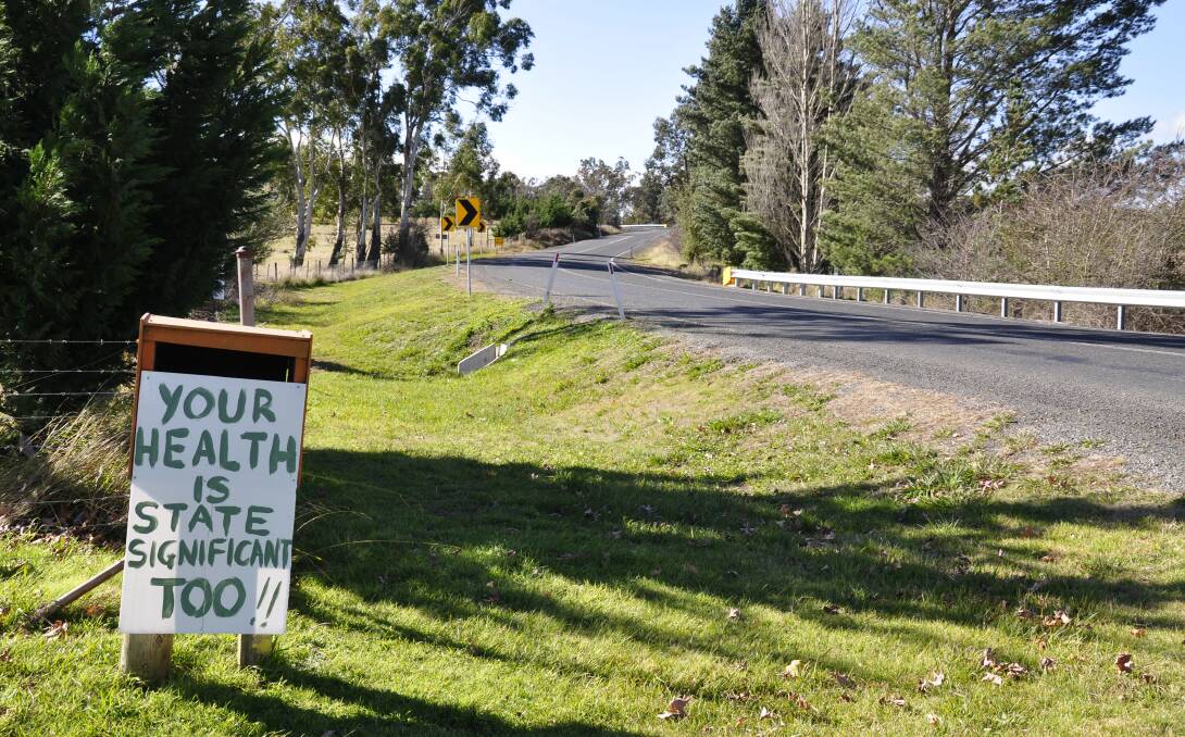 Bungonia and district residents have made their feelings well known with placards along Jerrara Road. They say the road is unsafe in its current condition to accommodate more trucks. Jerrara Power has stated it would upgrade the road. Photo: Louise Thrower.